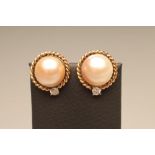 A PAIR OF MABE PEARL FRENCH CLIP EAR STUDS, the pink/grey tinted pearls set to open rope twist