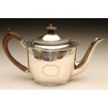 A LATE GEORGE III SILVER TEAPOT, maker's mark I.B., London 1805, of oval form, the hinged swept flat