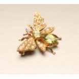 A PERIDOT AND SEED PEARL 9CT GOLD FLY BROOCH, London 1979, 1" wide (Est. plus 21% premium inc.