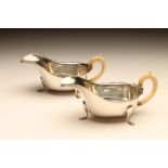 A PAIR OF ART DECO SILVER SAUCEBOATS, maker Viners, Sheffield 1936, of oval form with everted cut