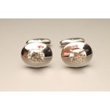 A PAIR OF SILVER CUFFLINKS, the domed oval panels set with oval facet cut moissanite on shaped