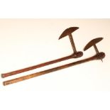 TWO ZULU AXES, the first possibly late 19th century with 8 1/2" blade and 25" hardwood shaft, the