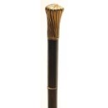 A SWORD STICK, early 20th century, with 13 1/4" fullered blade, bone joint buff, wrythen gilt