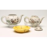 TWO FRENCH FAIENCE TEAPOTS, 19th century, both of globular form, one with a cover painted in