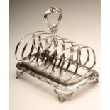 A VICTORIAN SILVER SEVEN BAR TOASTRACK, maker J & J Williams, Exeter 1856, the butterfly bars