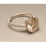 A SOLITAIRE MOISSANITE RING, the brilliant cut stone of approximately 3cts claw set to a plain