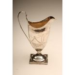 A GEORGE III SILVER MILK JUG, maker probably Charles Hougham, London 1791, bright cut engraved