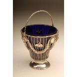 A GEORGE III SILVER WIREWORK SUGAR BASKET, maker's mark C.M. (see p.209, Jackson's, name not traced,