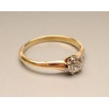 A SOLITAIRE DIAMOND RING, the brilliant cut stone of approximately 0.40cts, claw set to a plain 18ct