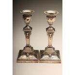 A PAIR OF LATE VICTORIAN SILVER CANDLESTICKS, maker Turner Bradbury, London 1899, the leaf