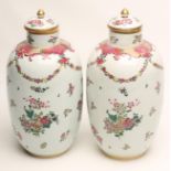 A PAIR OF CONTINENTAL PORCELAIN VASES AND COVERS, c.1900, probably French, on-glaze painted in