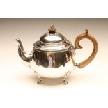 A SILVER TEAPOT, maker probably W. Neale Ltd., Birmingham 1920, of plain rounded form, the low domed