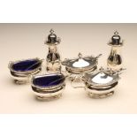 A SILVER COMPOSITE SIX PIECE CRUET, maker Adie Bros., Birmingham 1936 and 1938, of oblong baluster