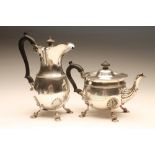 AN EDWARDIAN SILVER TEAPOT AND HOT WATER JUG, maker Wakely & Wheeler, London 1905 (teapot) and 1906,