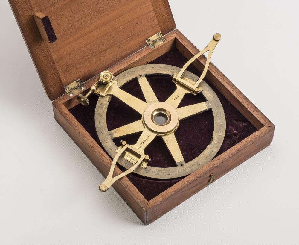 A GILT BRASS PROJECTOR, maker Edward Davis, Leeds, with engraved scale to outer ring, moveable