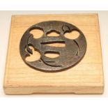 A JAPANESE TSUBA of circular form, pierced with cherries and signed on both sides of the nakago-ana,