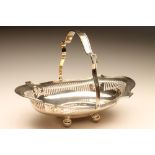 AN EDWARDIAN SILVER BASKET, maker Fattorini & Sons, Birmingham 1909, of shaped oval form with cast