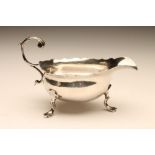 A GEORGE II SILVER SAUCEBOAT, maker's mark mis-struck, possibly W.B., London 1752, of oval form with