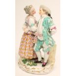A MEISSEN PORCELAIN FIGURE GROUP, 19th century, modelled as a young couple wearing colourful 18th