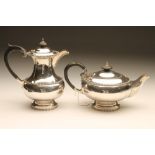 A SILVER TEAPOT AND COFFEE POT, maker Walker & Hall, Sheffield 1950, of baluster form with cast reel