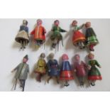 A set of eleven miniature wood "Dancing Piano Dolls", c.1880's, with carved and painted conical