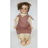 A French S.F.B.J. bisque head doll with brown glass sleeping eyes, open mouth and teeth, brown