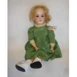 An Armand Marseille bisque head doll with brown glass sleeping eyes, open mouth and teeth, blonde