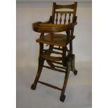 An Edwardian baby's high chair converting to rocking chair, in stained beechwood with baluster