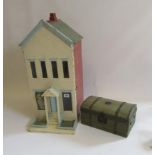 An Edwardian doll's house, the hinged fascia with central front door and porch with steps, flanked