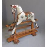 A rocking horse, stand marked "Made by Crown Products Ossett Yorks", mid 20th century, in dappled