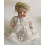 An Armand Marseille bisque head toddler doll, with pale blue sleeping eyes, open mouth and teeth,