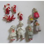 Three German all bisque porcelain miniature dolls with adjustable heads, comprising googly eyed boy,