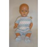 A German celluloid baby doll with fixed blue glass eyes, closed mouth, swivel joints, 22" high,