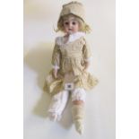 A Kestner bisque head and shoulders doll, with brown glass sleeping eyes, open mouth and teeth,