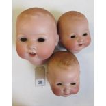 Three Armand Marseille bisque heads, lacking eyes, open mouths, one with teeth, moulded hair, marked