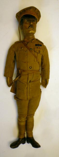 A World War I Officer doll, c.1915, with moulded composition head, inset blue glass eyes, stuffed