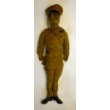 A World War I Officer doll, c.1915, with moulded composition head, inset blue glass eyes, stuffed