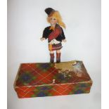 A German bisque head Highland doll with brown glass sleeping eyes, open mouth and teeth, ginger