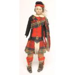 A papier mache head Highland costume male doll, c.1860's, with moulded, painted features, stitched