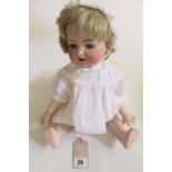 A Kammer & Reinhardt bisque head doll, with blue glass flirty/sleeping eyes, open mouth and teeth,