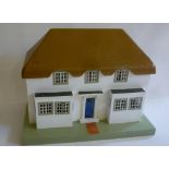 A Triang dolls house, replica of the Queen and Princess Margaret's playhouse in Windsor Great