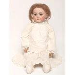 An S.F.B.J. bisque head doll, with blue glass sleeping eyes, open mouth and teeth, pierced ears,