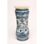 A SPANISH MAIOLICA ALBARELLO, c.1750, of waisted cylindrical form, painted in blue with a village in