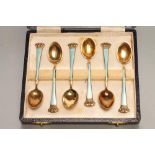 A SET OF SIX DANISH ART DECO SILVER GILT AND ENAMEL COFFEE SPOONS, stamped Sterling, with crown