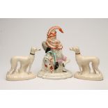 A VICTORIAN STAFFORDSHIRE POTTERY FLATBACK FIGURE, modelled as Mr Punch, seated with Dog Toby on a