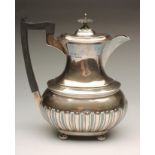 A SILVER COFFEE POT, maker Walker & Hall, Sheffield 1933, of semi-fluted rounded oblong baluster