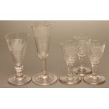 A SET OF THREE GEORGIAN WINE GLASSES, early 19th century, the bowls with cut and engraved flowers on