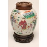 A CHINESE PORCELAIN JAR of ovoid form, on-glaze painted in coloured enamels with a dignitary