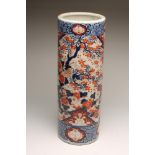 AN IMARI PORCELAIN STICK STAND, c.1900, of plain cylindrical form, painted in typical palette with