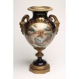 A FRENCH PORCELAIN GARNITURE VASE, late 19th century, of ovoid form, painted in polychrome enamels